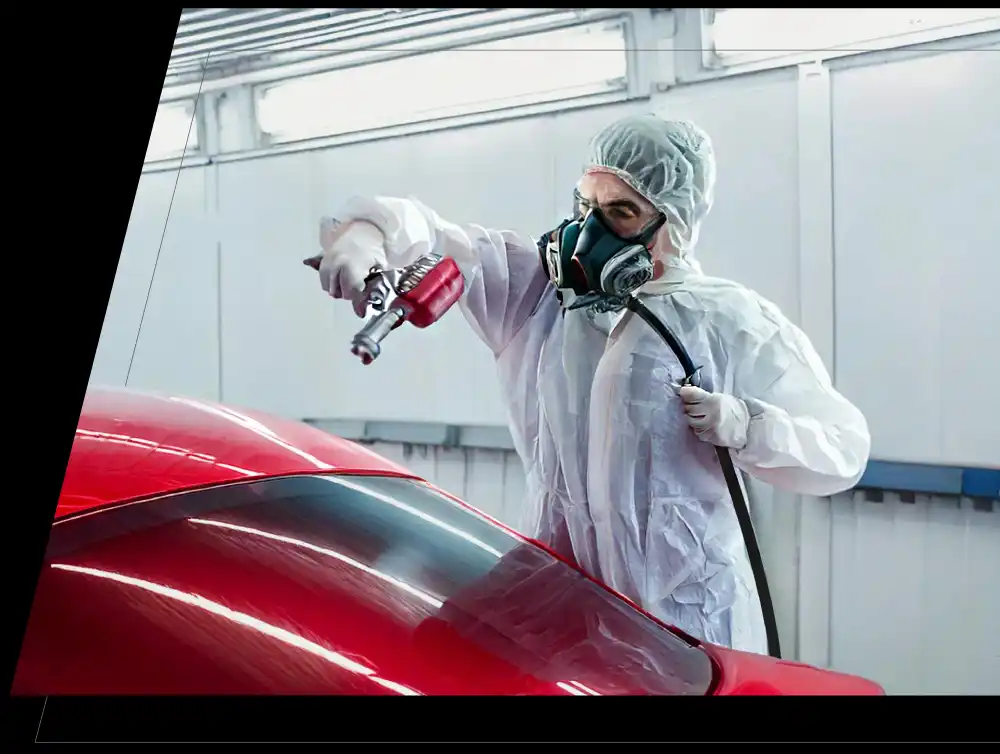Monkey Nuts Paint Technican spraying a vehicle